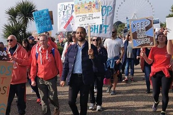 Josh marching against sewage dumping